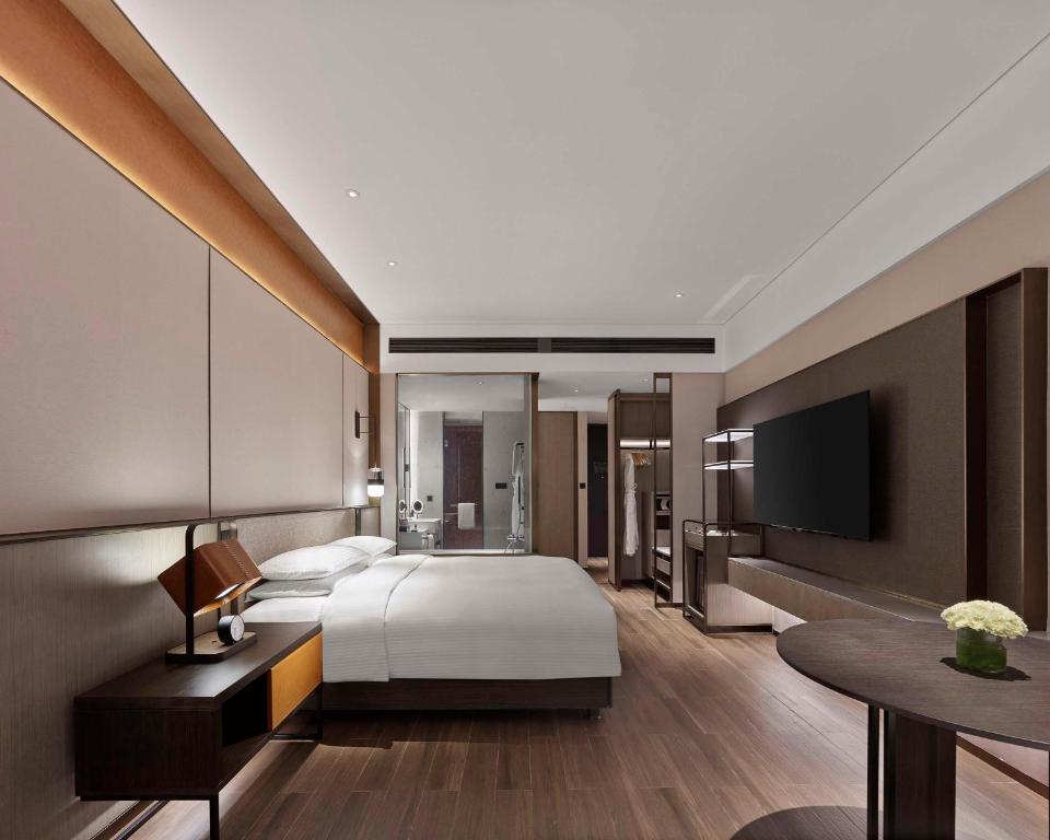 Postel nebo postele na pokoji v ubytování Hyatt Regency Shanghai Songjiang