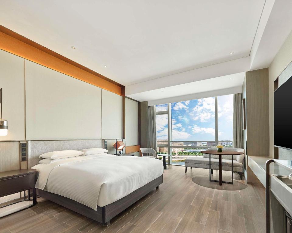 Postel nebo postele na pokoji v ubytování Hyatt Regency Shanghai Songjiang