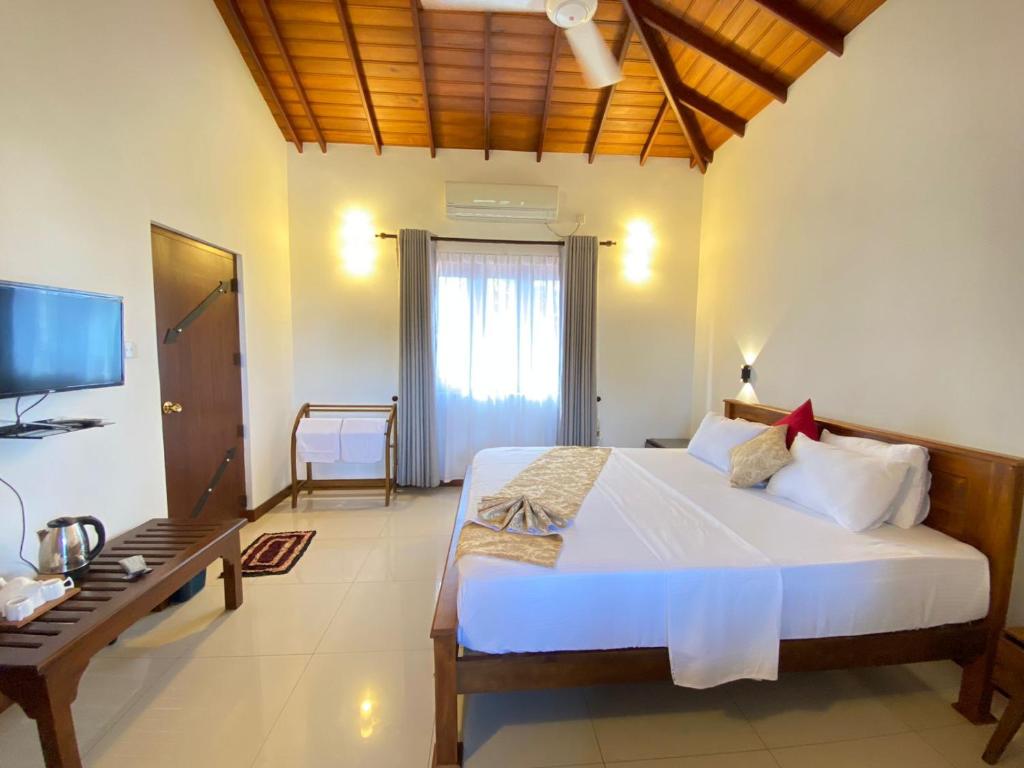 Postel nebo postele na pokoji v ubytování New Sea Villa
