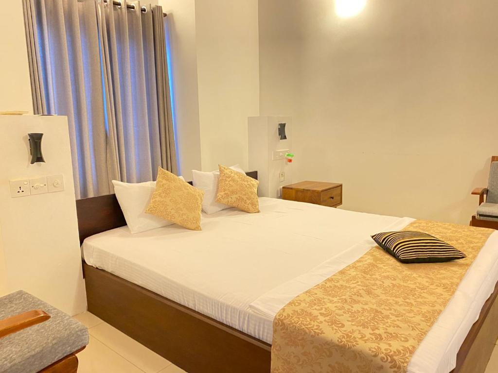 Postel nebo postele na pokoji v ubytování New Sea Villa