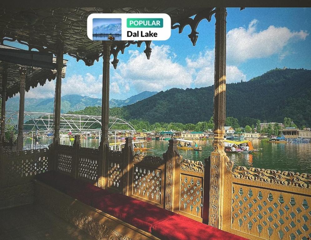 a balcony with a view of a body of water at Nazneen Group Of Houseboats in Srinagar