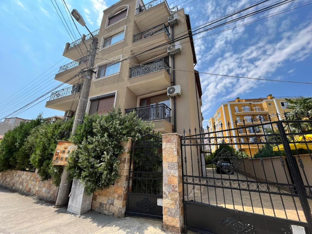 a building with a gate in front of it at Vqra Sarafovo in Burgas