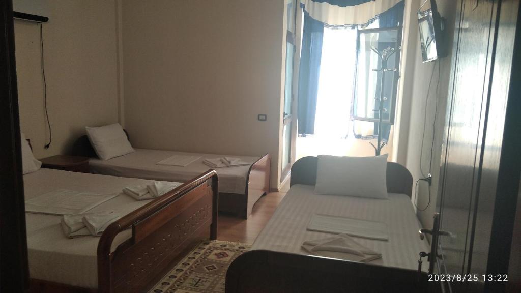 Postel nebo postele na pokoji v ubytování Hotel Saint Marena