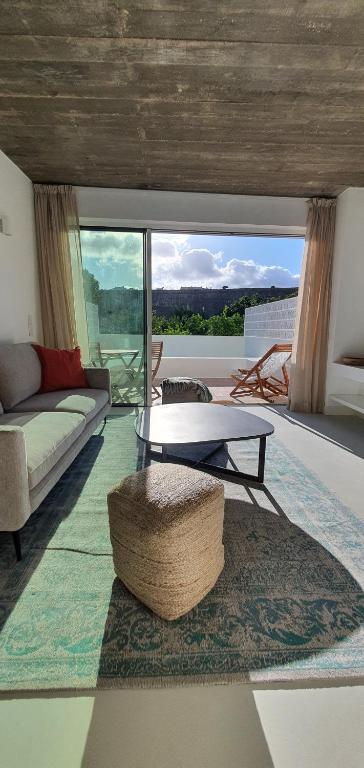 a living room with a couch and a coffee table at Lemon Villa in Lagos