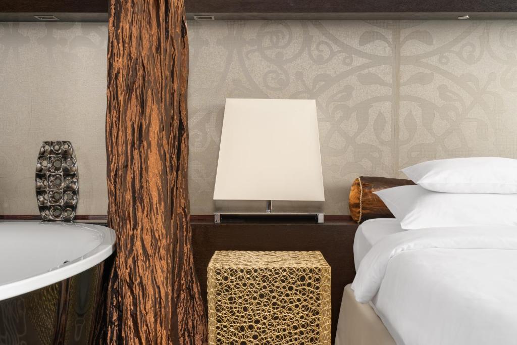 Postel nebo postele na pokoji v ubytování Falkensteiner Hotel Belgrade Superior
