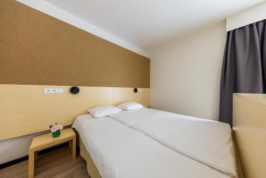 Postel nebo postele na pokoji v ubytování Saaremaa Rannahotell ' Beach Hotel