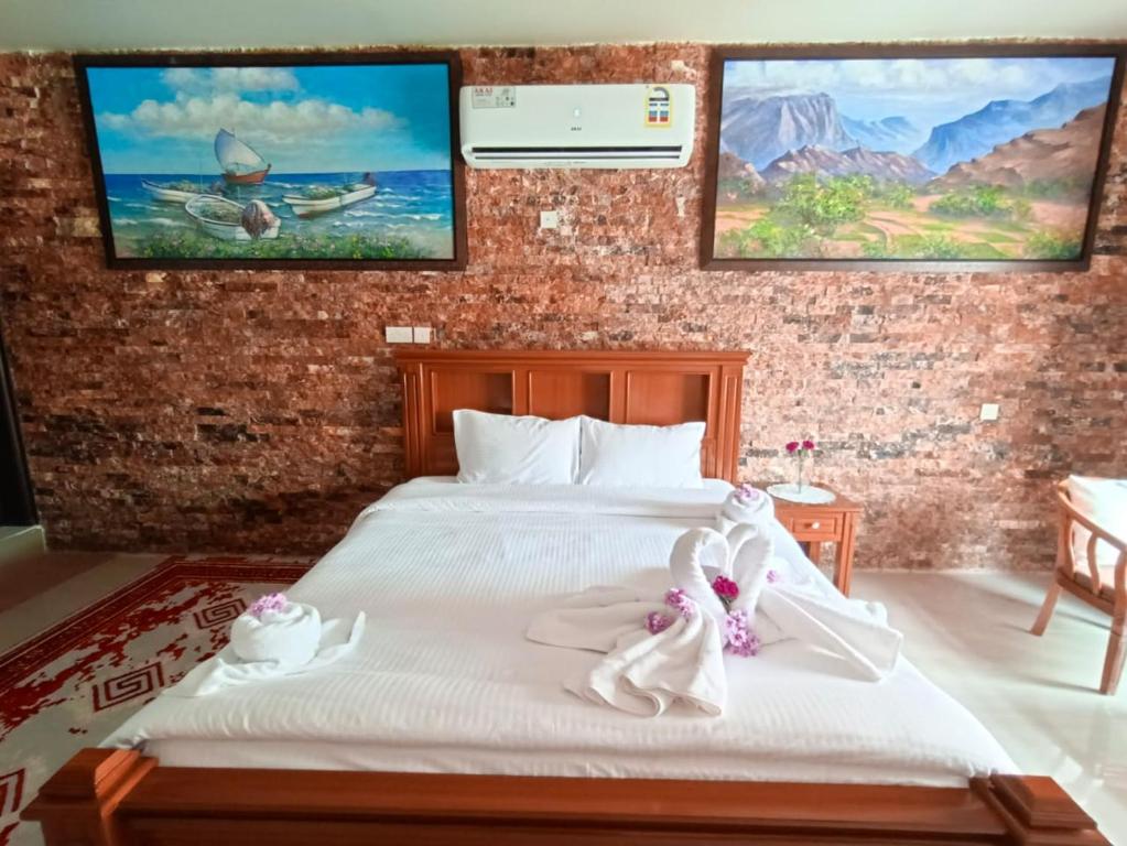 Postel nebo postele na pokoji v ubytování Durrat Nizwa Inn