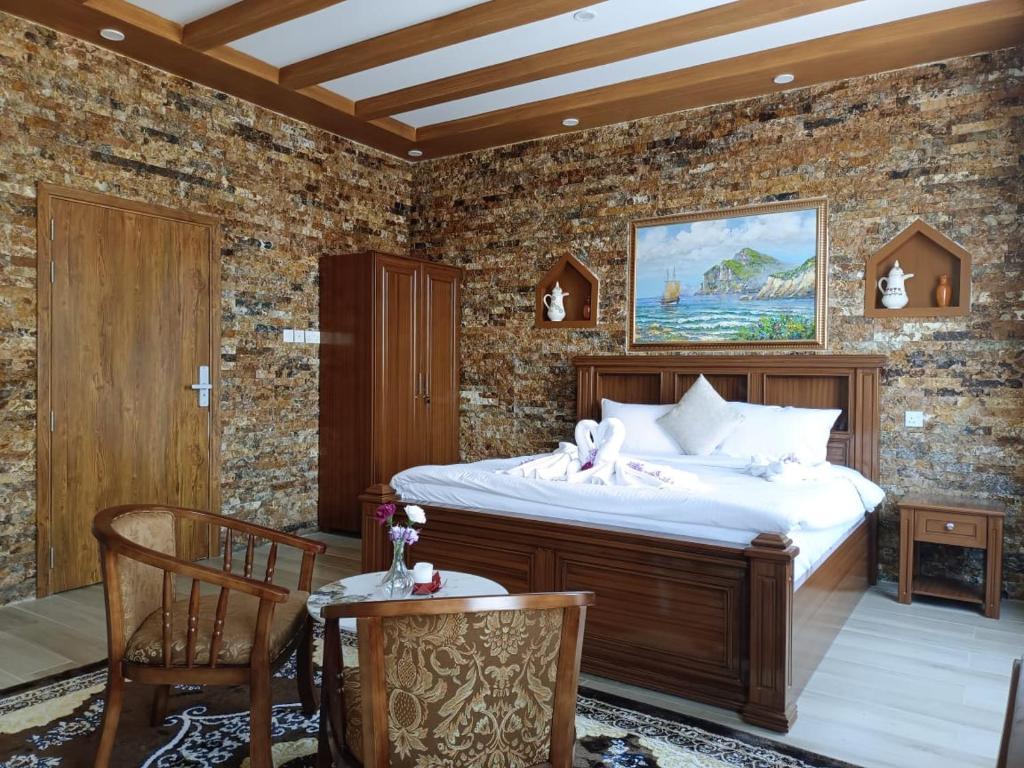 Postel nebo postele na pokoji v ubytování Durrat Nizwa Inn