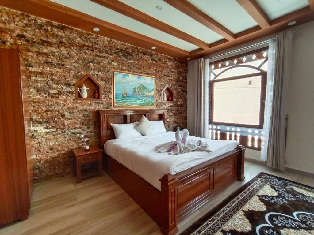 Postel nebo postele na pokoji v ubytování Durrat Nizwa Inn