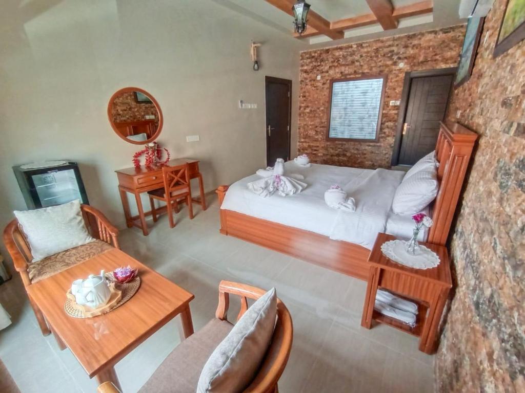 Postel nebo postele na pokoji v ubytování Durrat Nizwa Inn