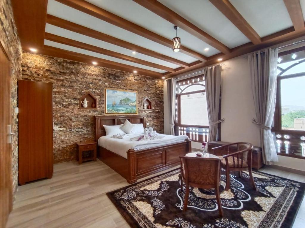 Postel nebo postele na pokoji v ubytování Durrat Nizwa Inn