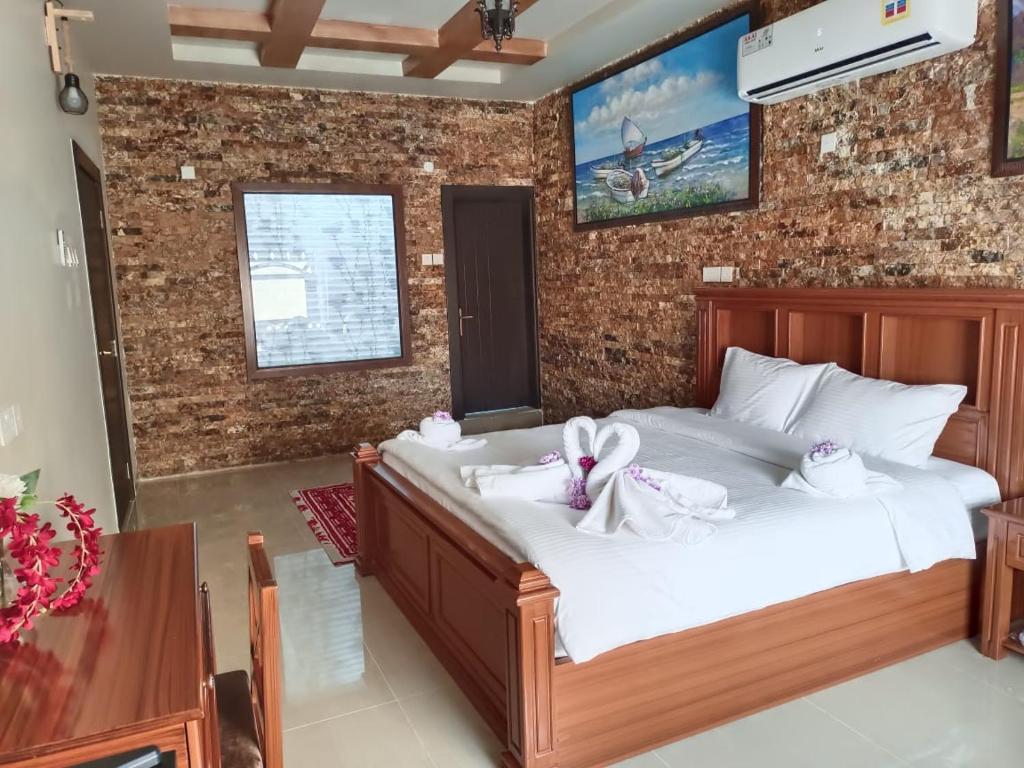 Postel nebo postele na pokoji v ubytování Durrat Nizwa Inn
