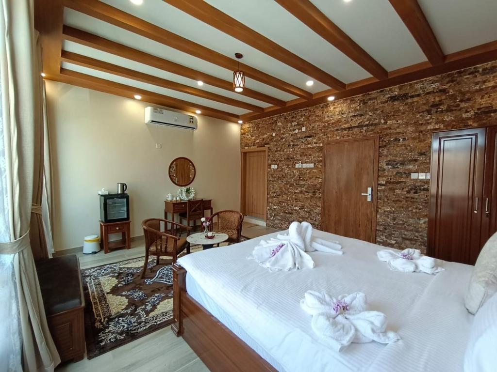 Postel nebo postele na pokoji v ubytování Durrat Nizwa Inn