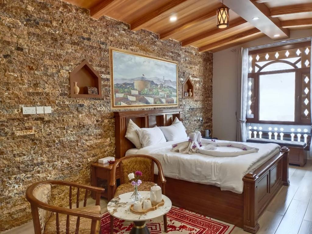 Postel nebo postele na pokoji v ubytování Durrat Nizwa Inn