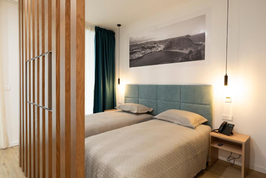 Postel nebo postele na pokoji v ubytování Horta Bay