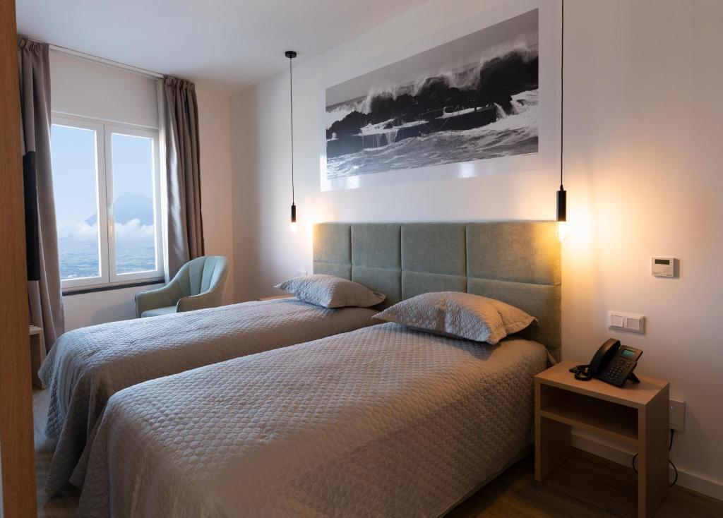 Postel nebo postele na pokoji v ubytování Horta Bay