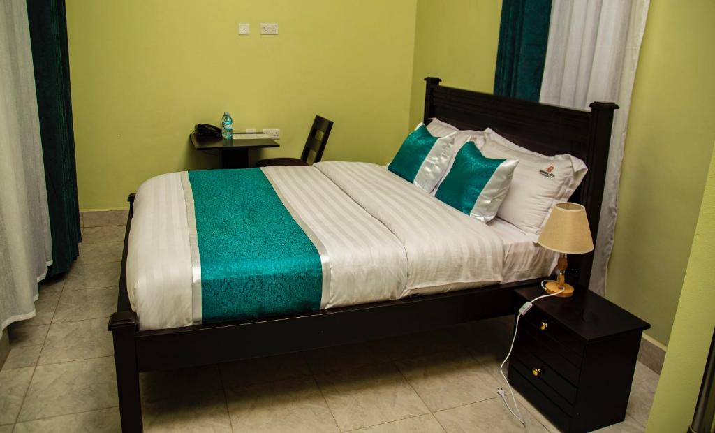 Postel nebo postele na pokoji v ubytování BWIRANDA HOTEL