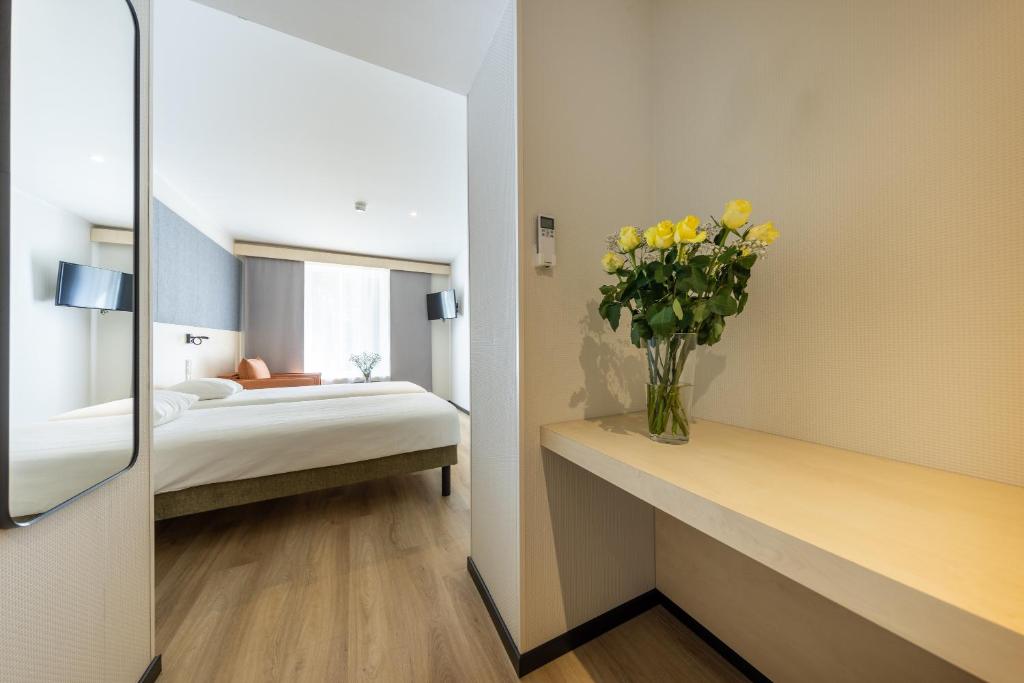 Postel nebo postele na pokoji v ubytování Saaremaa Rannahotell ' Beach Hotel