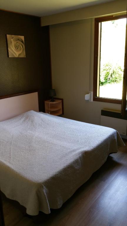 Postel nebo postele na pokoji v ubytování Le Magiot