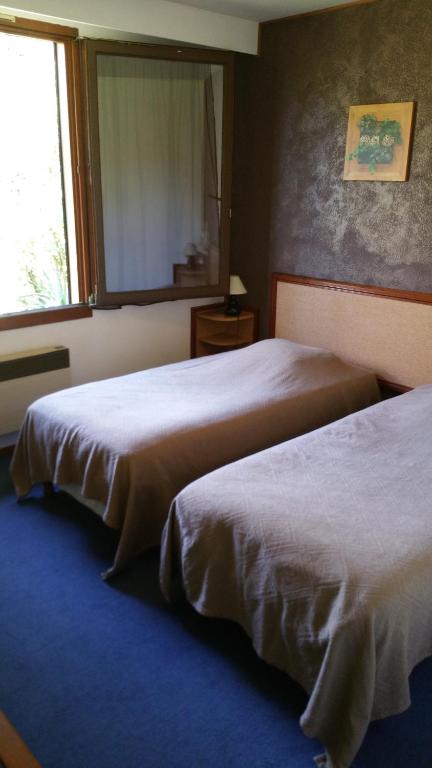 Postel nebo postele na pokoji v ubytování Le Magiot