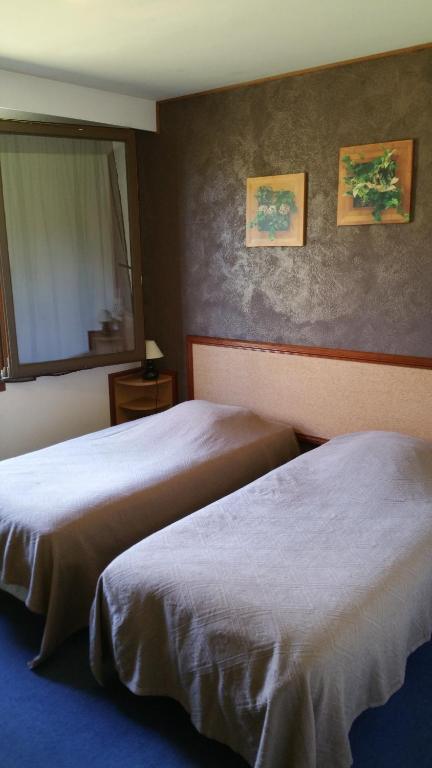 Postel nebo postele na pokoji v ubytování Le Magiot