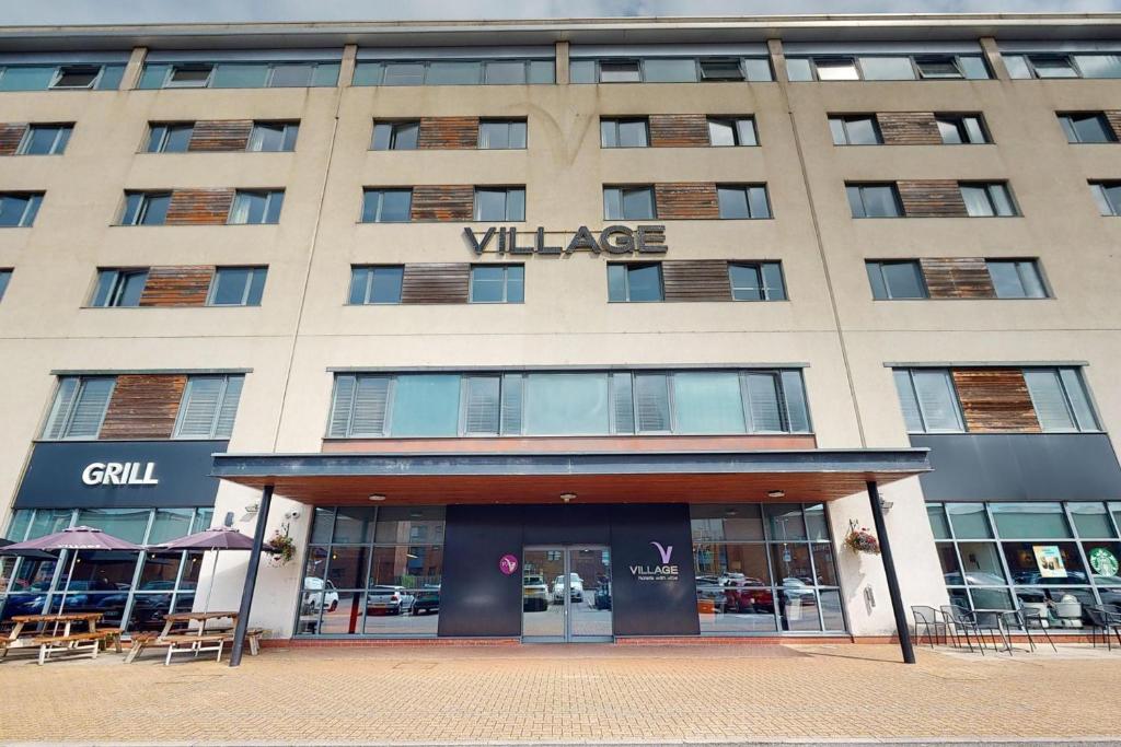 a large building with a villa sign on it at Village Hotel Swansea in Swansea