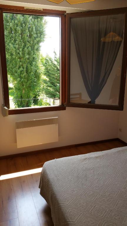 Postel nebo postele na pokoji v ubytování Le Magiot