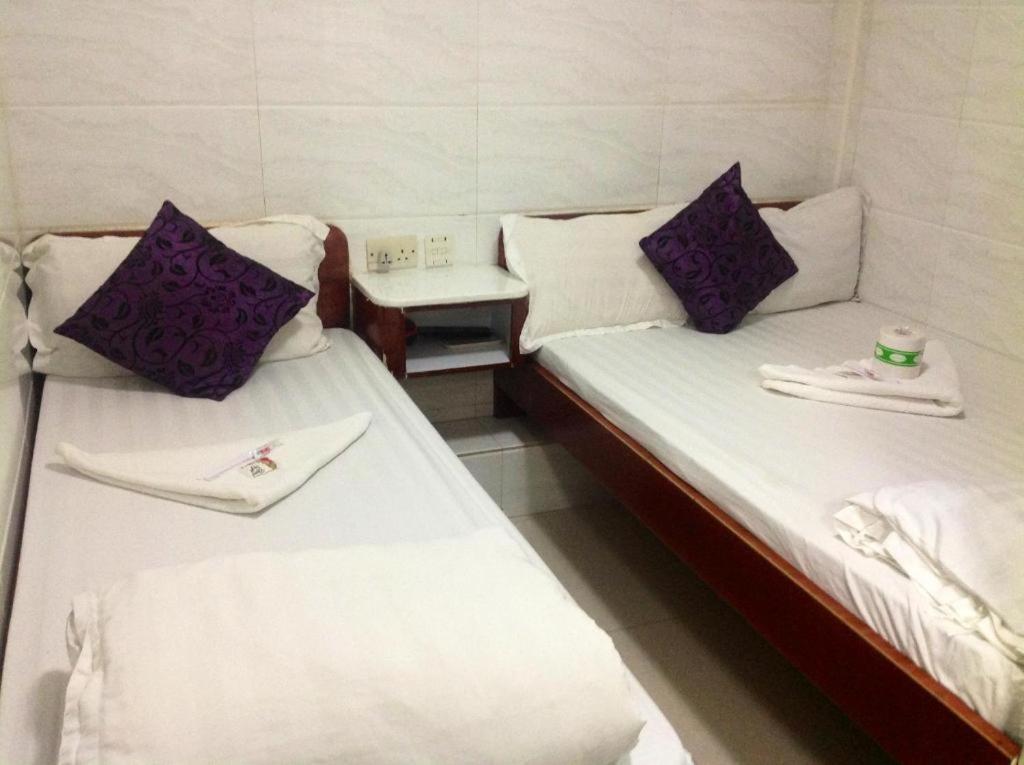 Postel nebo postele na pokoji v ubytování Reliance Inn