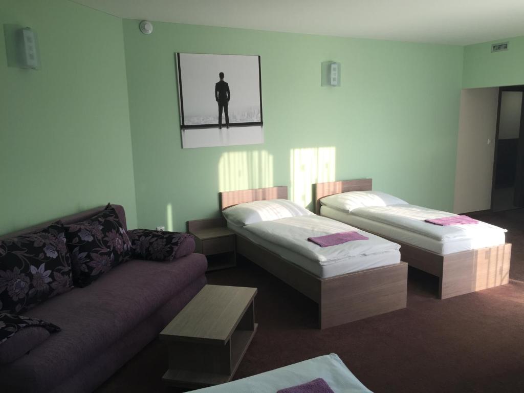 Postel nebo postele na pokoji v ubytování Wellness Pension Inovec