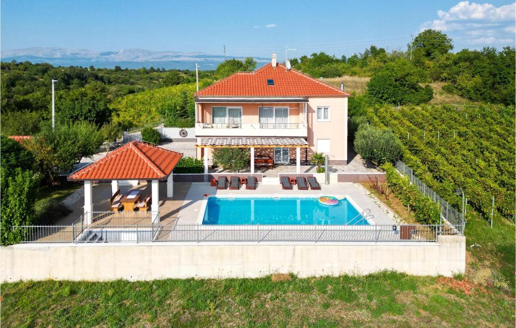 an aerial view of a house with a swimming pool at Nice Home In Trilj With House A Panoramic View in Trilj