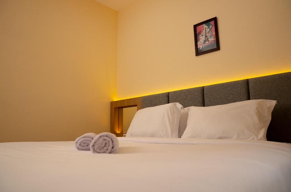 Postel nebo postele na pokoji v ubytování Hotel Luansa Klui
