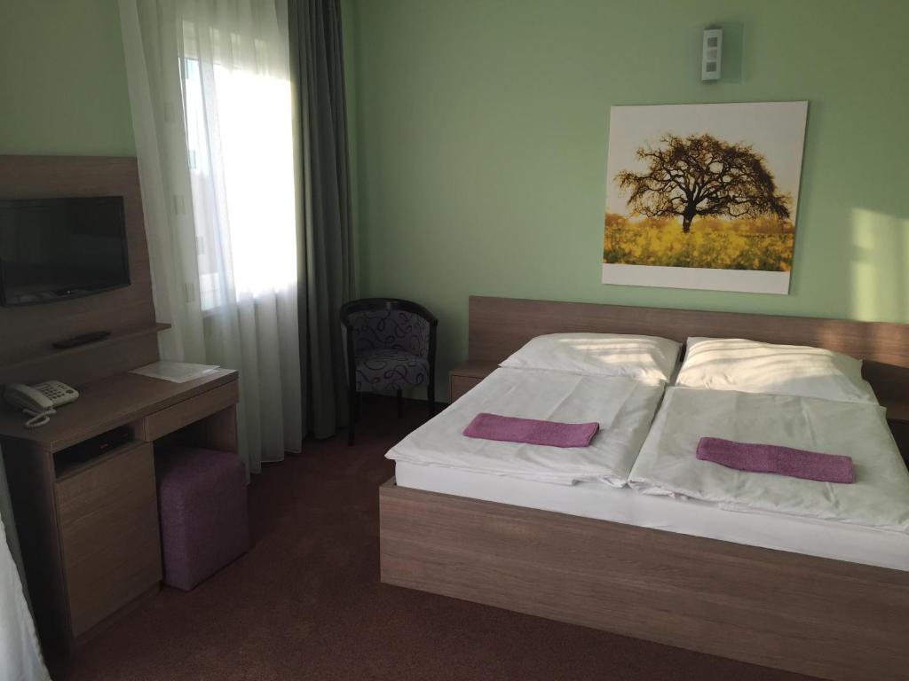 Postel nebo postele na pokoji v ubytování Wellness Pension Inovec
