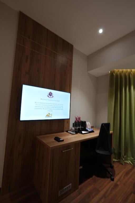 TV a/nebo společenská místnost v ubytování Travancore Court