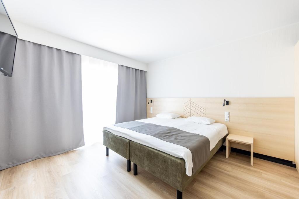 Postel nebo postele na pokoji v ubytování Saaremaa Rannahotell ' Beach Hotel