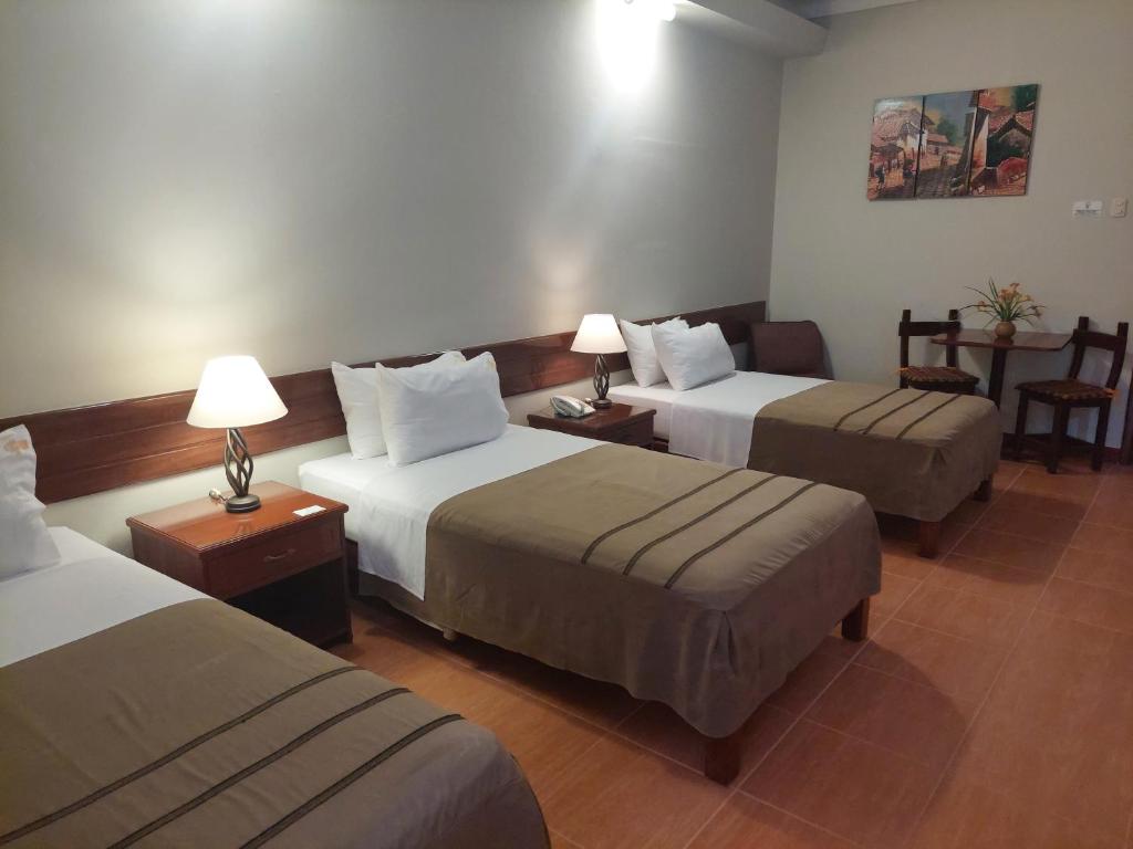 Postel nebo postele na pokoji v ubytování Lima Wasi Hotel Miraflores