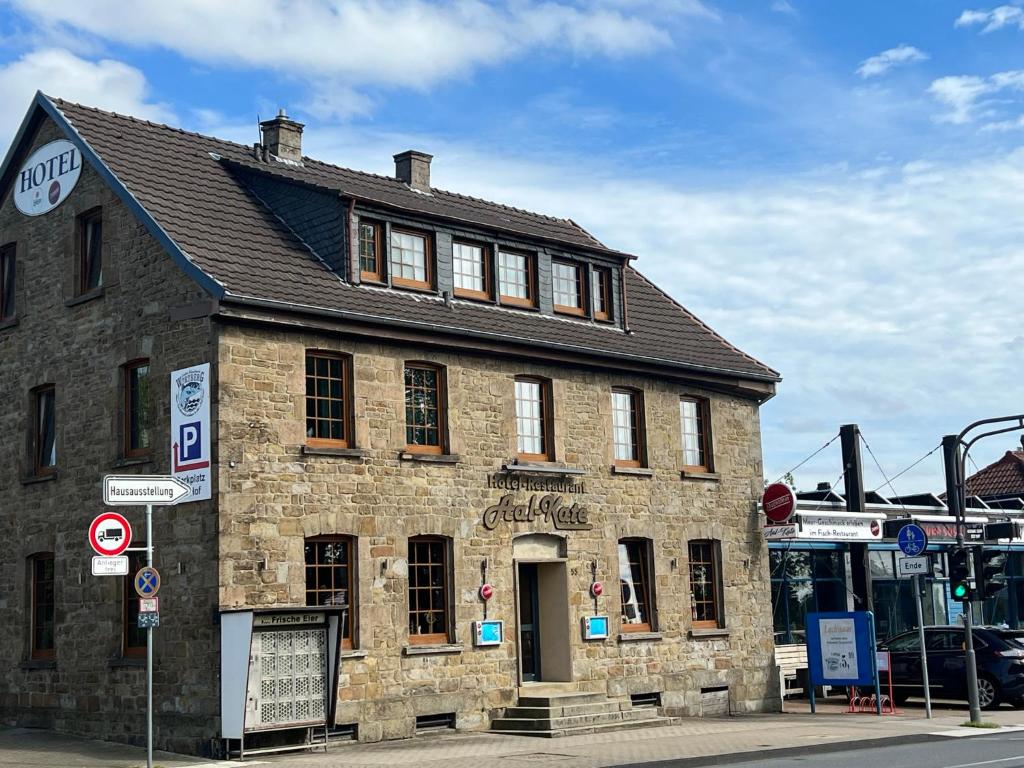 an old brick building on the corner of a street at Aal-Kate in Wuppertal