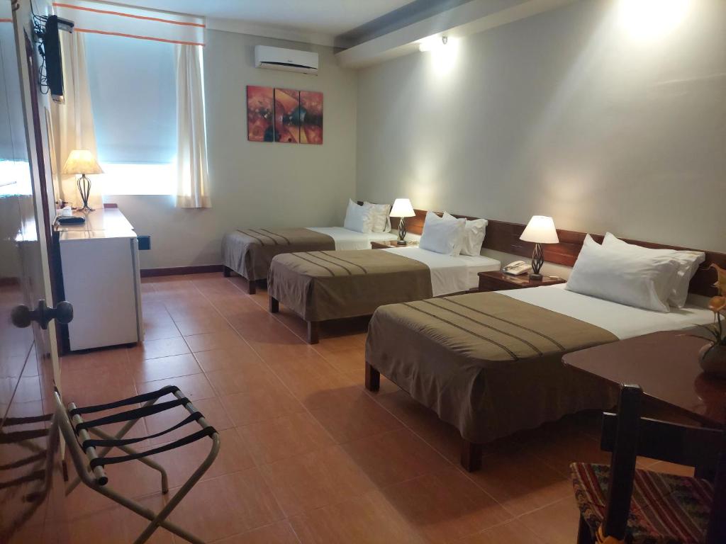 Postel nebo postele na pokoji v ubytování Lima Wasi Hotel Miraflores