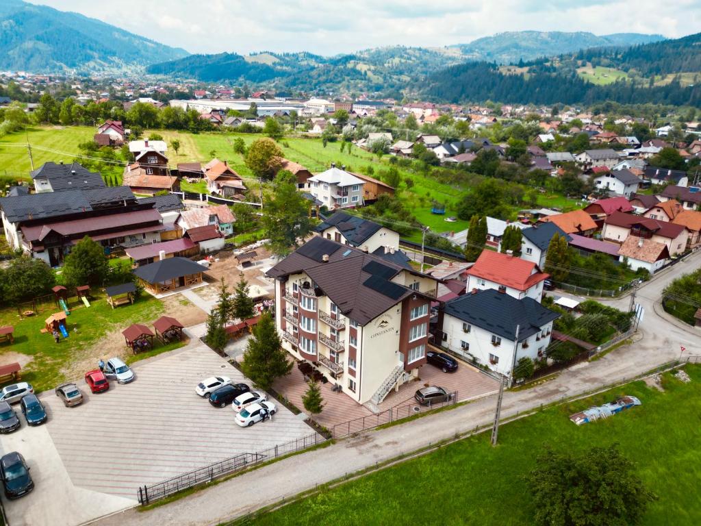 an aerial view of a town with cars parked in a parking lot at Complex Turistic Constantin Bucovina in Câmpulung Moldovenesc