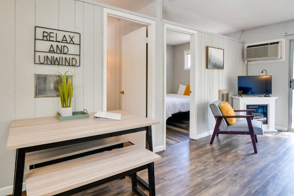 a living room with a desk and a bedroom at Kimberling City Oasis Boat Slip, Kayaks and More! in Kimberling City