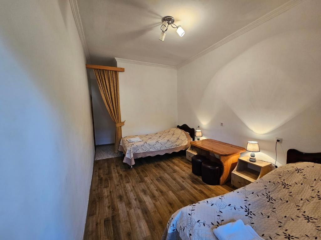 Postel nebo postele na pokoji v ubytování Guest House Aleksandre