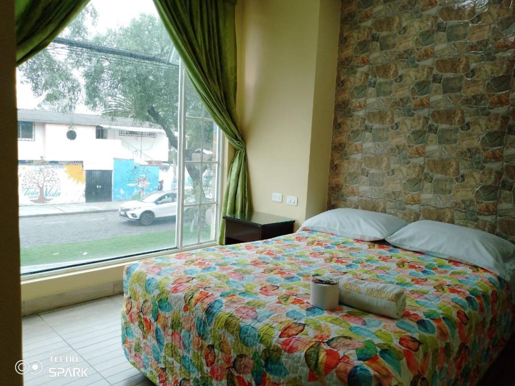 Postel nebo postele na pokoji v ubytování HOSPEDAJE YACUCALLE