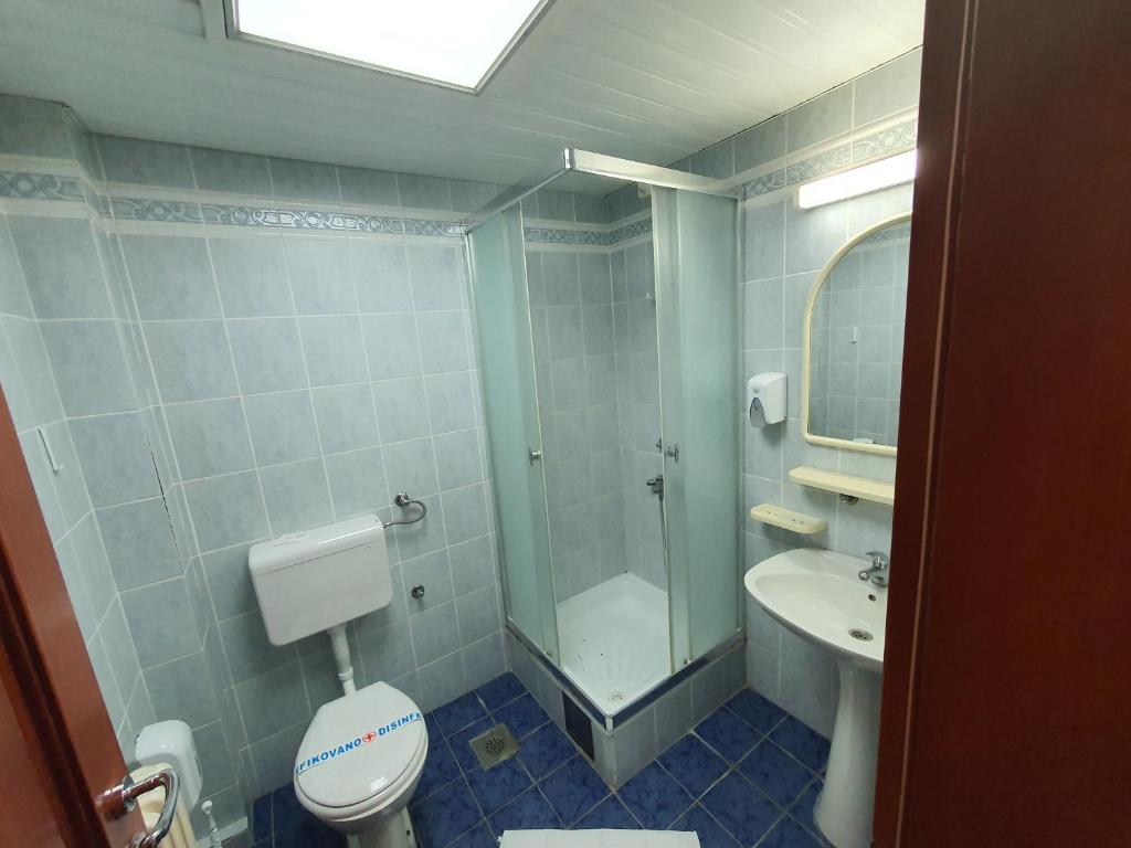 Koupelna v ubytování Hotel Norcev