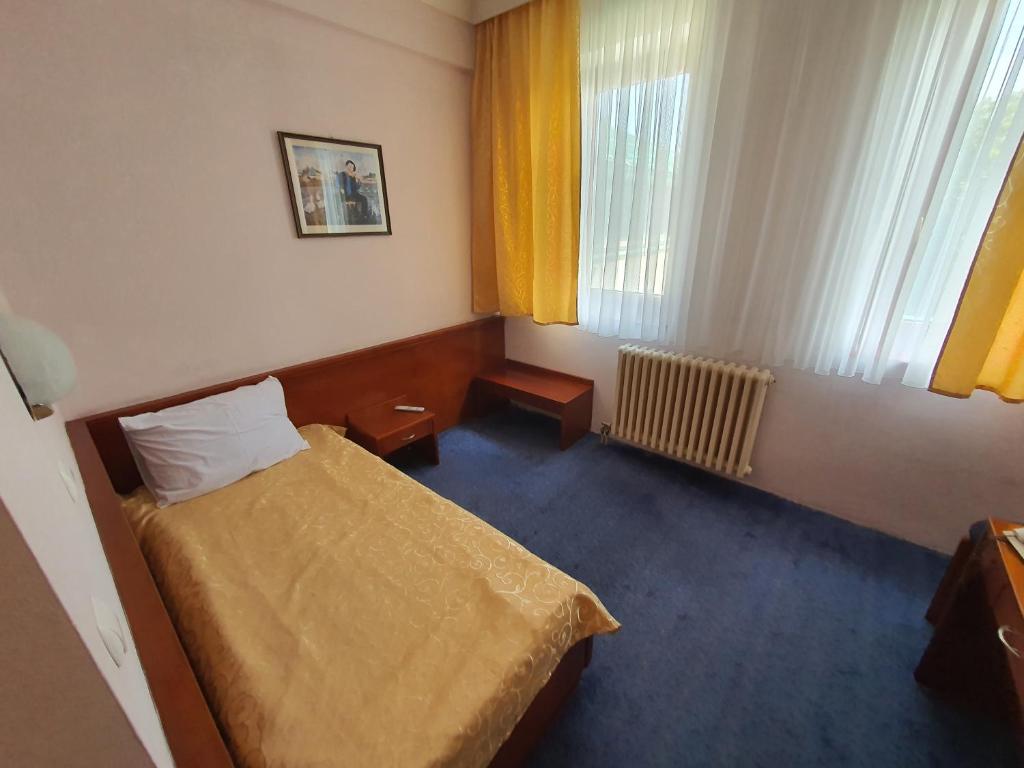 Postel nebo postele na pokoji v ubytování Hotel Norcev