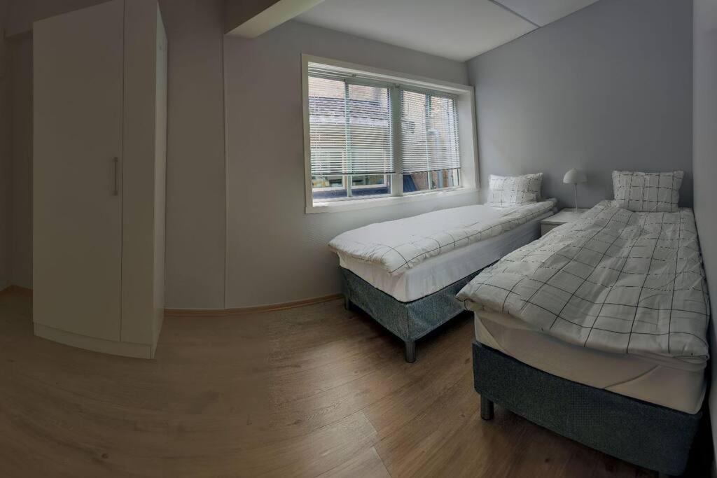 Postel nebo postele na pokoji v ubytování Arctic Tromso Apartment 1