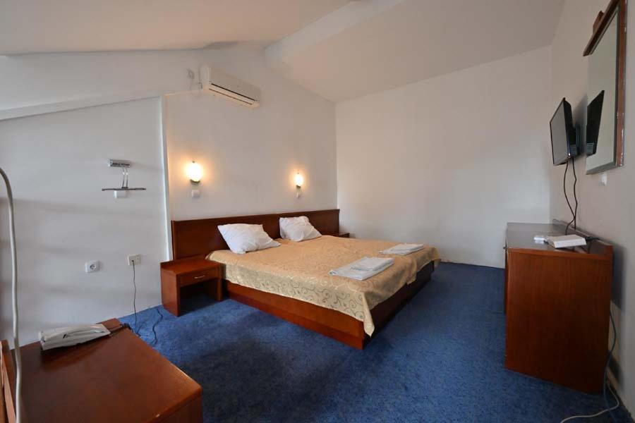Postel nebo postele na pokoji v ubytování Hotel Norcev