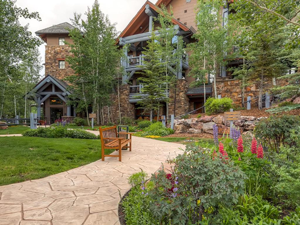 a house with a bench in front of it at Bachelor Gulch Village in Avon