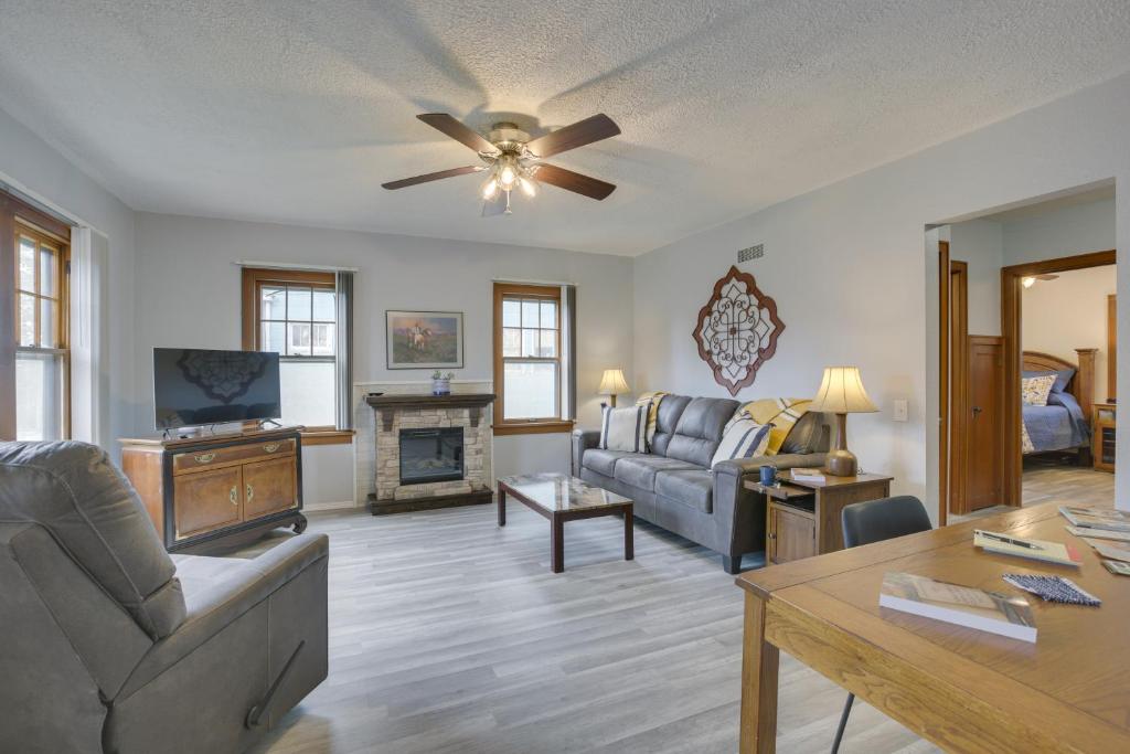 a living room with a couch and a fireplace at Glendive Getaway with Yellowstone River Access! in Glendive