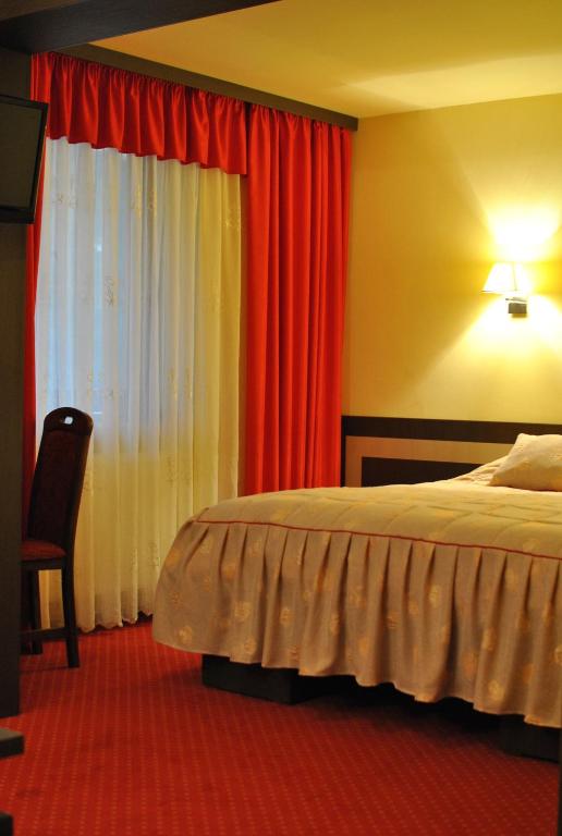 Postel nebo postele na pokoji v ubytování Hotel Dana