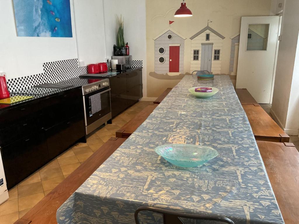 a kitchen with a table with a bowl on it at Admiralty House in Weymouth