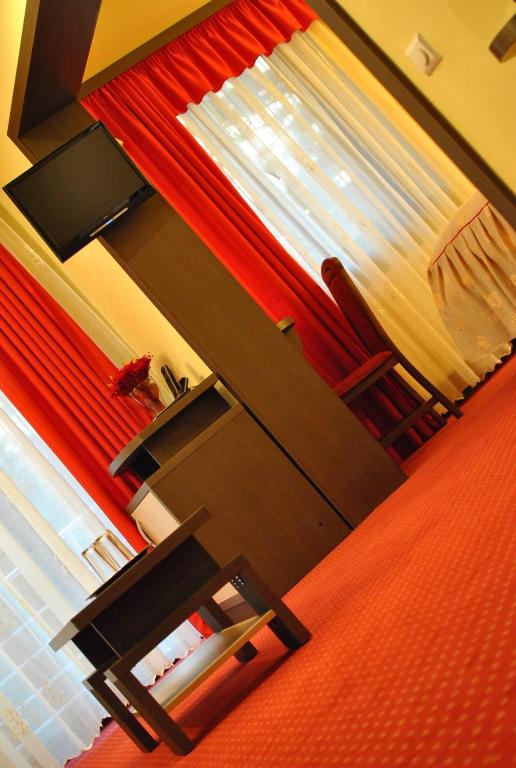 TV a/nebo společenská místnost v ubytování Hotel Dana
